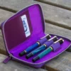 Galen Leather Zippered Three Pen Case In Purple